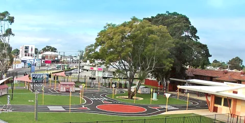 Aerial view of the Constable Care road safety school: a miniature town with real roads, roundabouts, crossings and traffic signals on a landscaped site