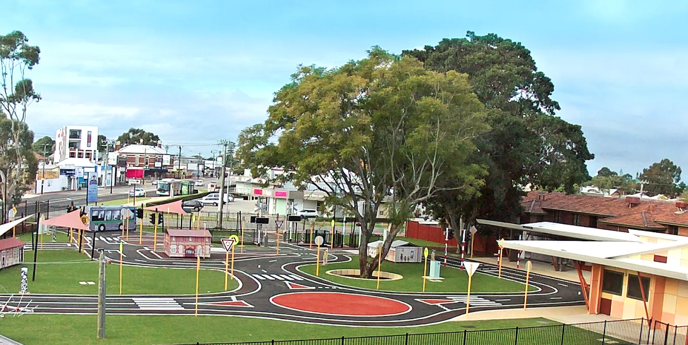 Aerial view of the Constable Care road safety school: a miniature town with real roads, roundabouts, crossings and traffic signals on a landscaped site