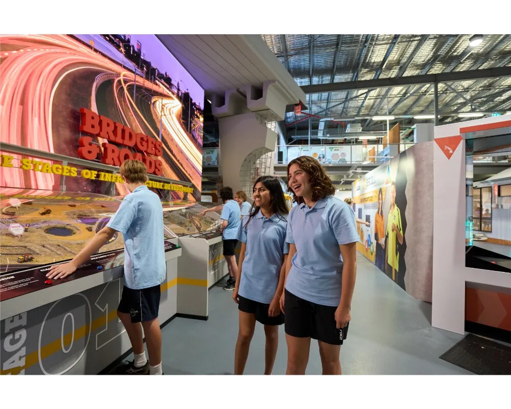 Students exploring the Bridges & Roads interactive exhibit at the Construction Futures Centre