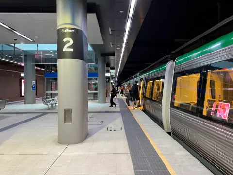 Platform 2 at a Perth Transperth station with train and passengers boarding
