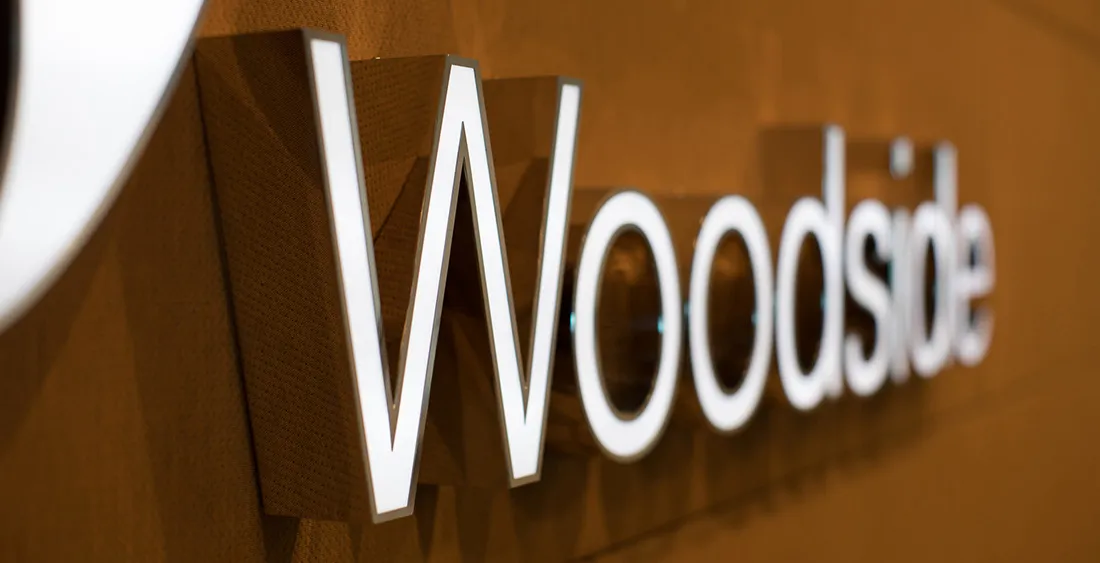 Illuminated 3D Woodside signage on textured copper wall at Mia Yellagonga